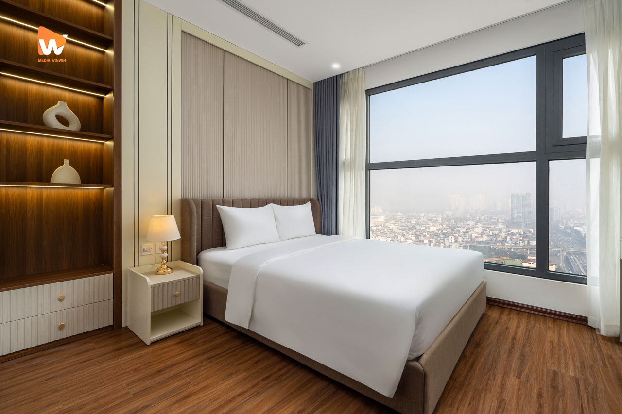 Chụp ảnh khách sạn Aravelle Suites — phòng ngủ căn suite nhìn ra thành phố