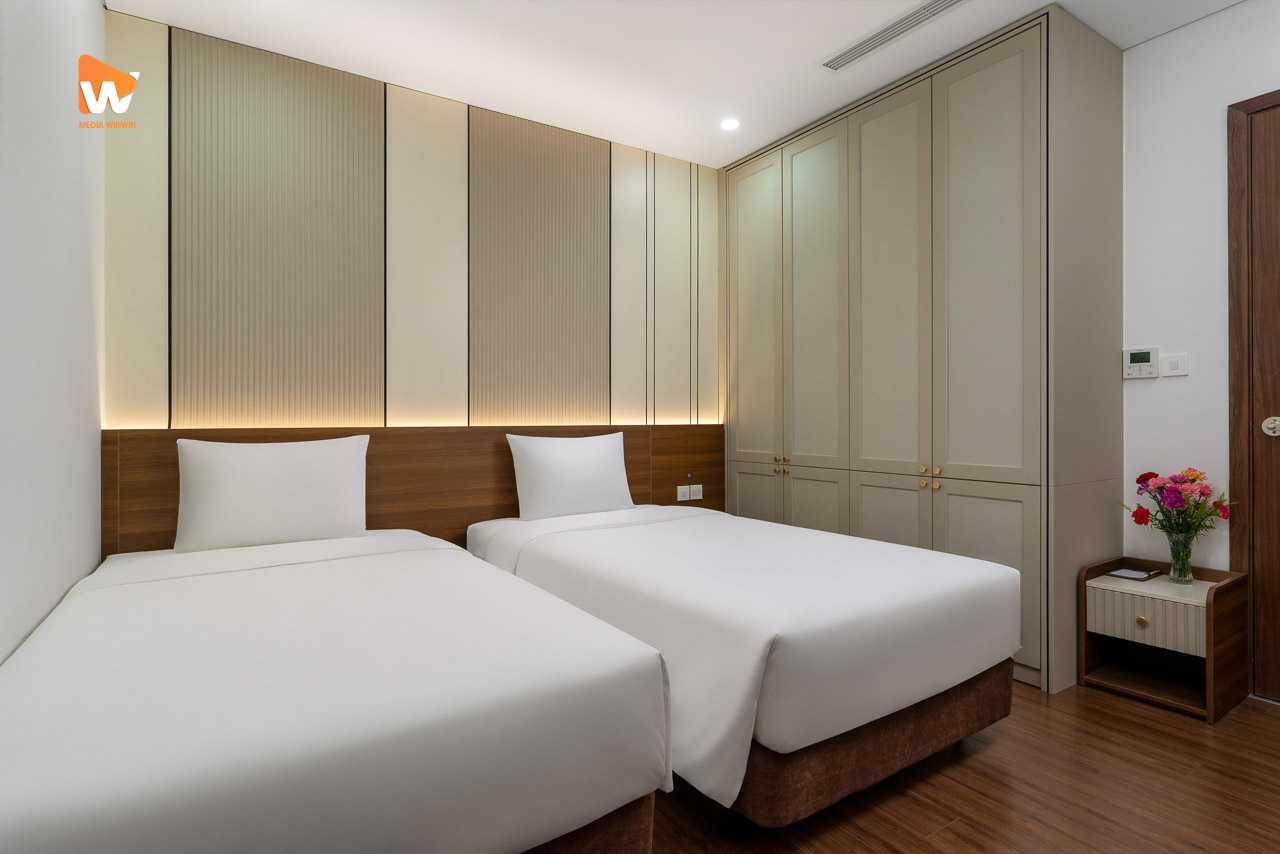 Chụp ảnh khách sạn Aravelle Suites — phòng ngủ hai giường căn suite